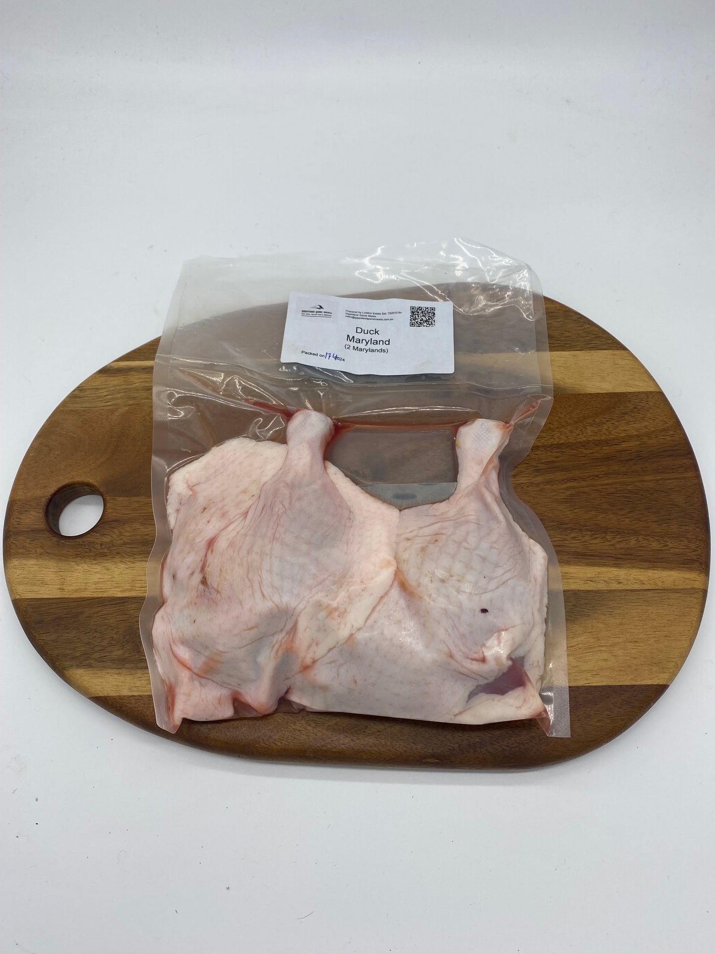 photo og two (2) Duck Maryland /legs cryovac and on a wooden boards