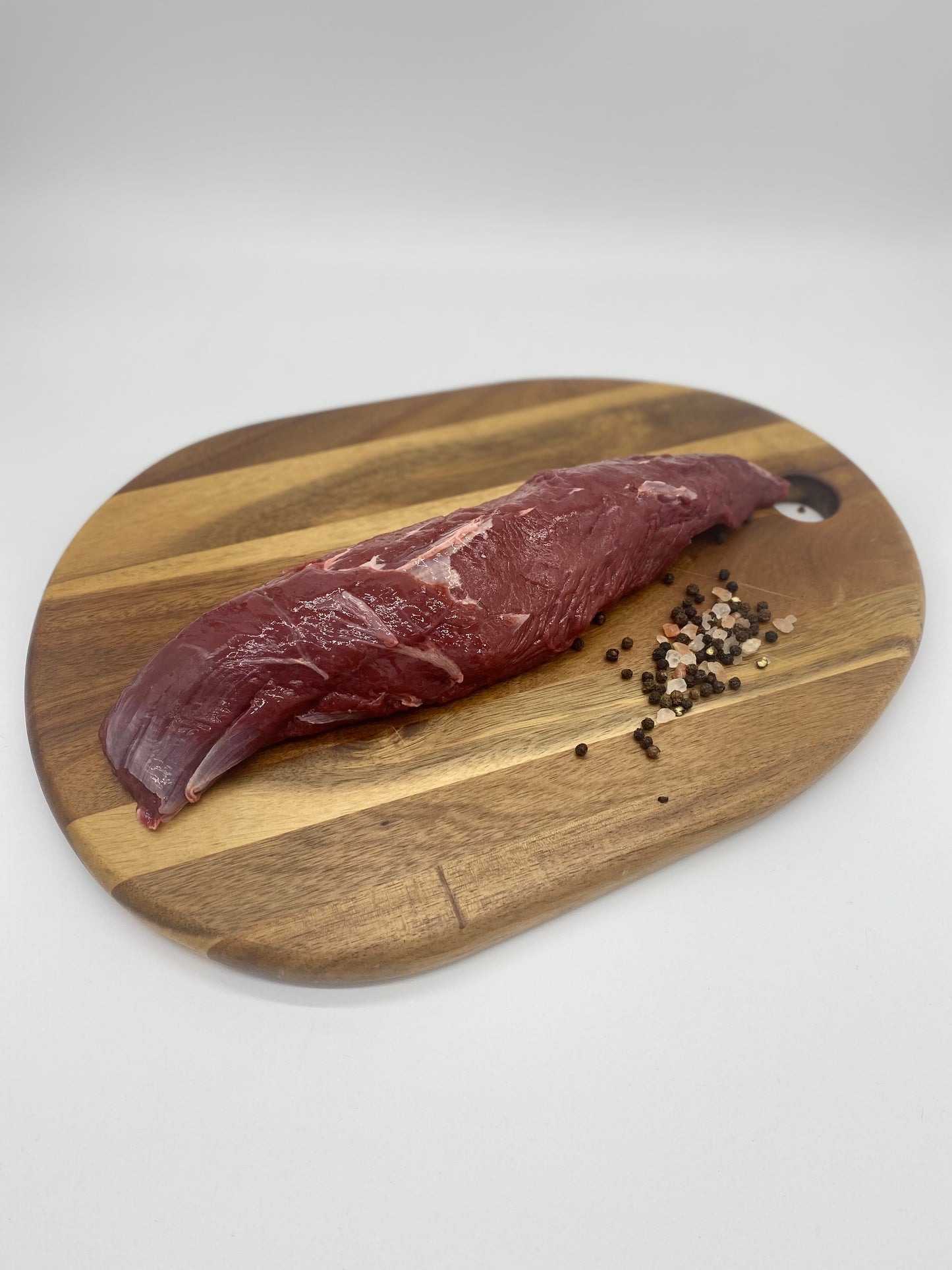 photo - Kangaroo Loin Fillet on a wooden board