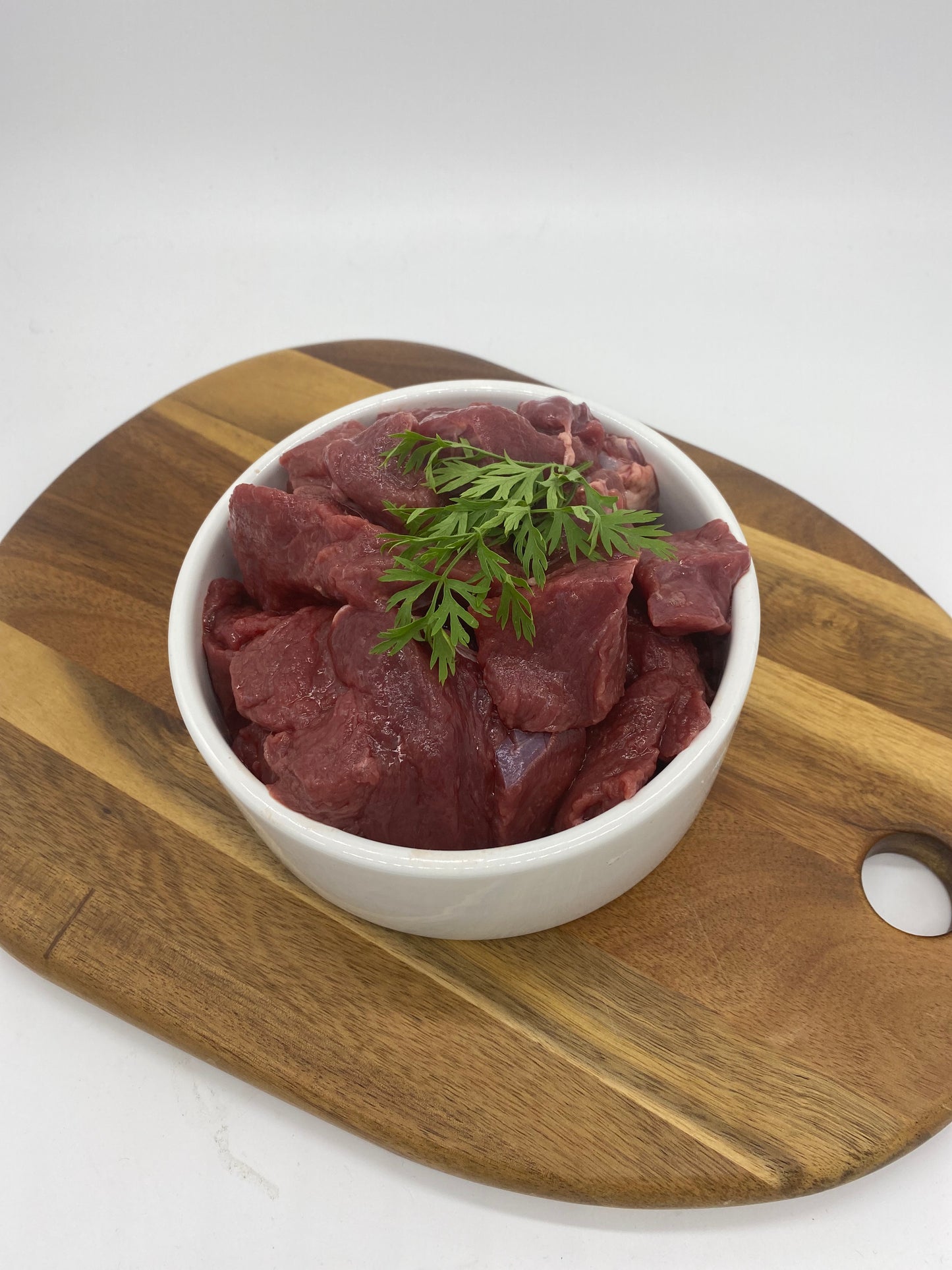 Photo - Diced venison in a dog bowl close up picture
