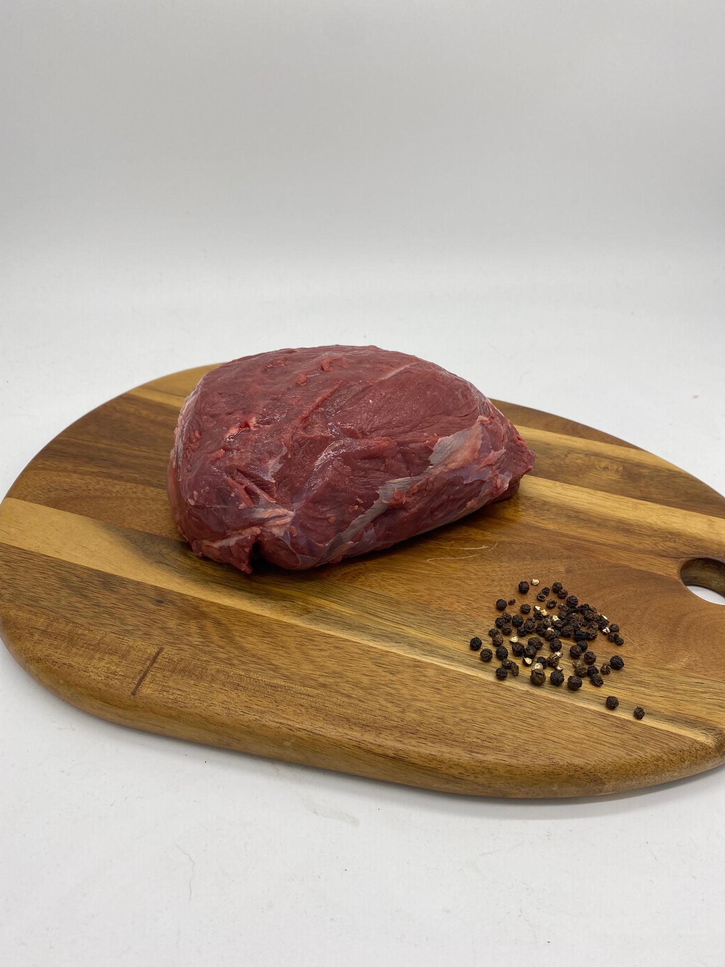 Photo - Venison Round Roast on a wooden board