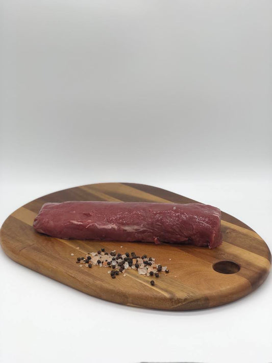 Photo - Venison backstrap on a wooden board