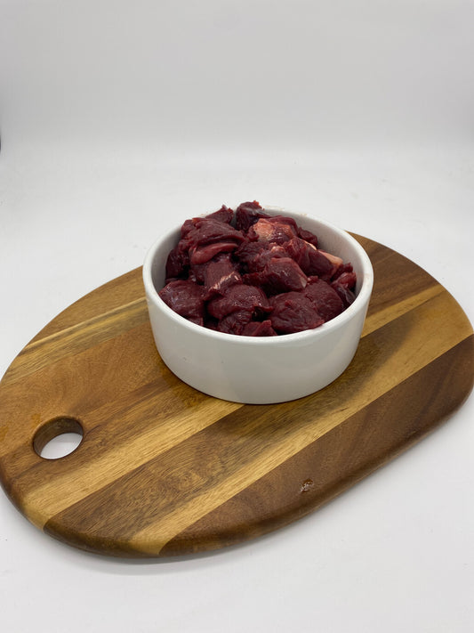 Kanagroo Meat diced in a white dog bowl