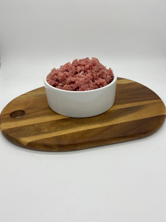 Photo - Rabbit Mince in a dog bowl on a wooden board