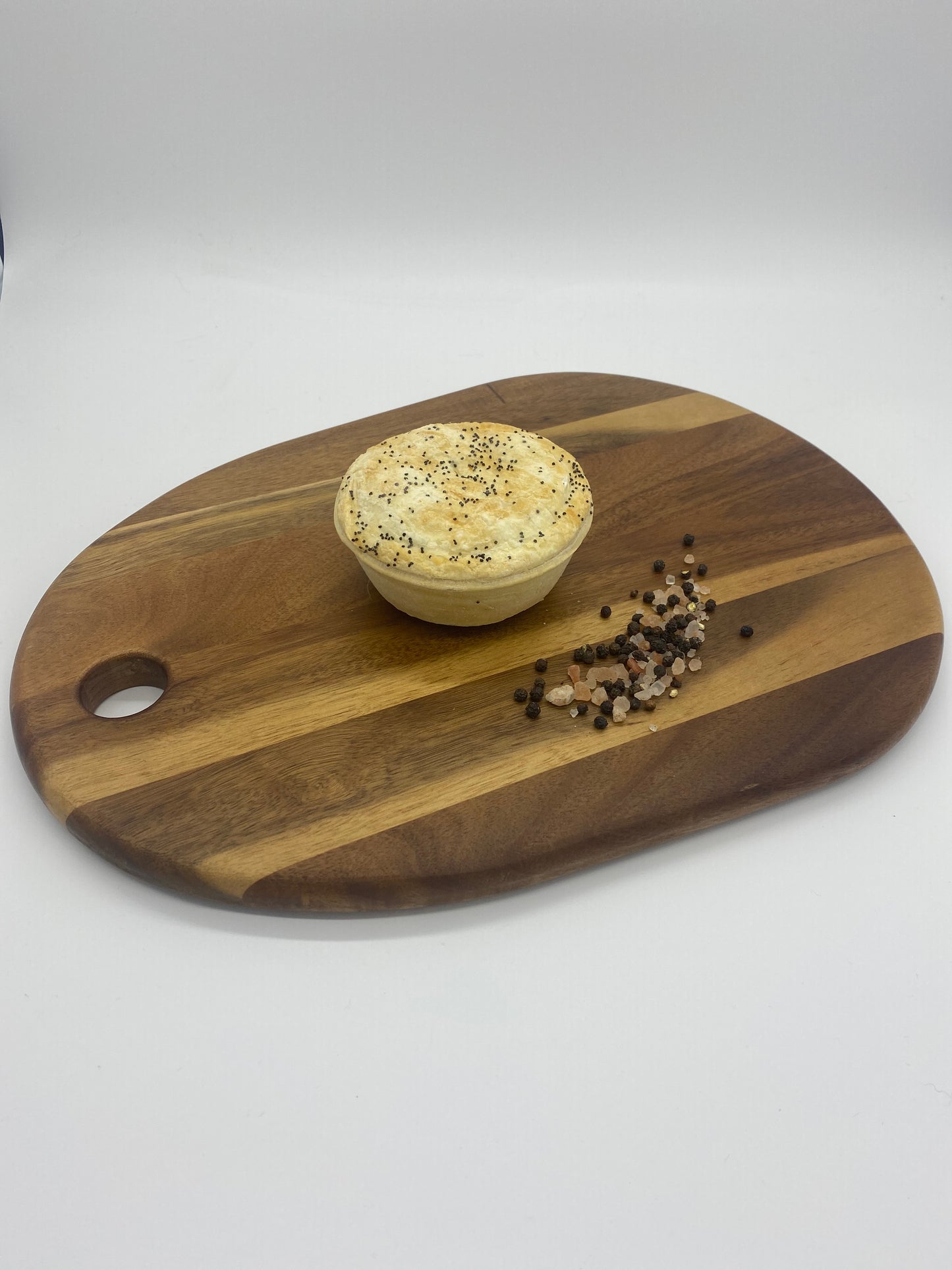 Photo - Lamb in red wine sauce with Rosemary on a wooden board 