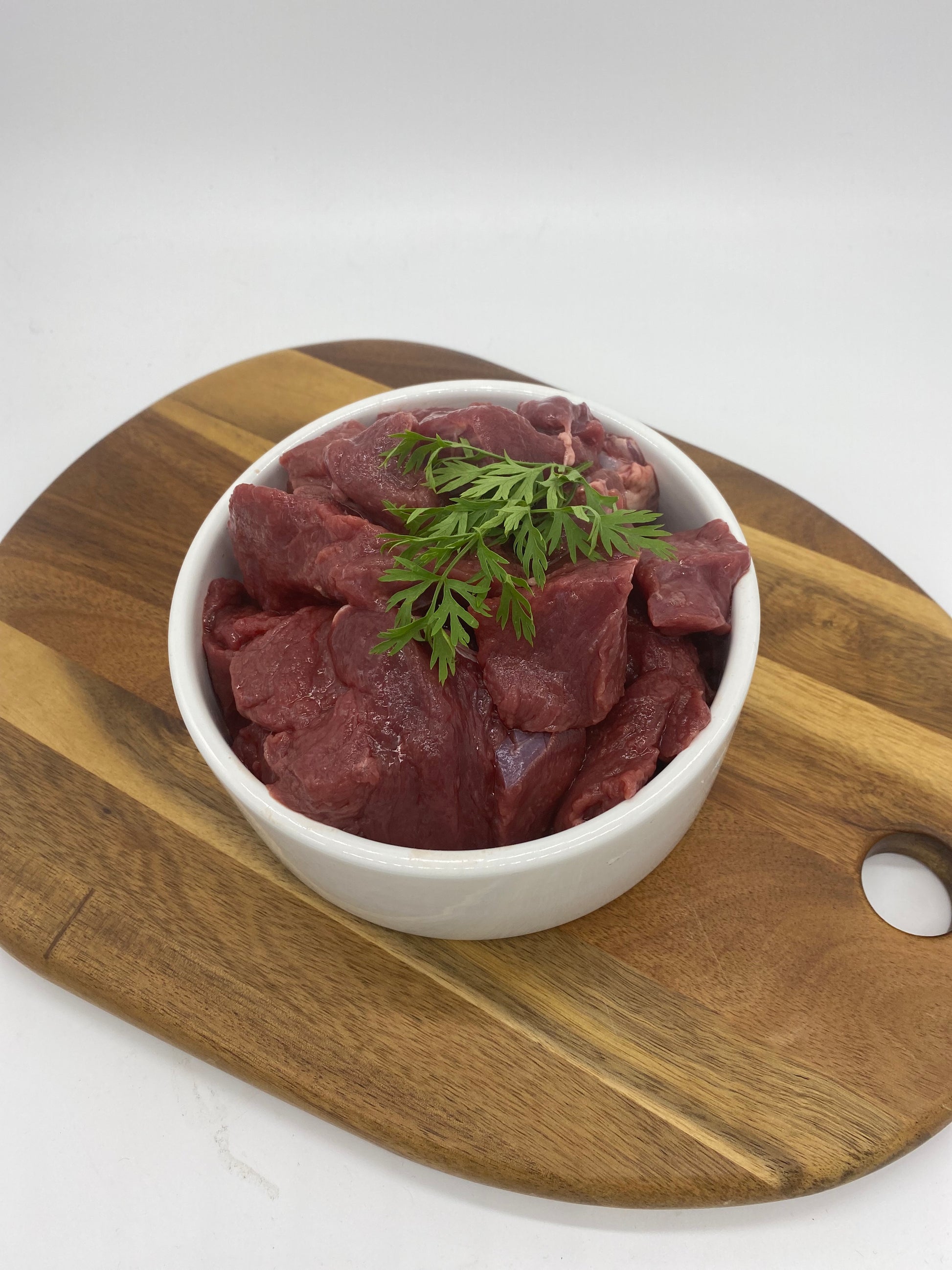 Photo - Diced venison in a dog bowl close up picture