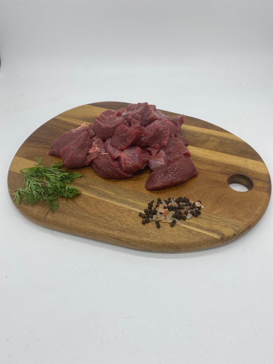 Photo - Diced venison on a wooden board 